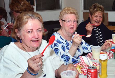 three senior women eating