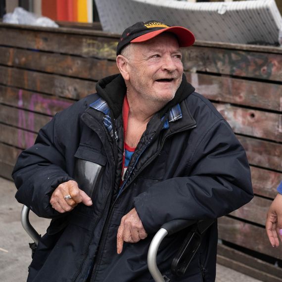 old man talking to employee