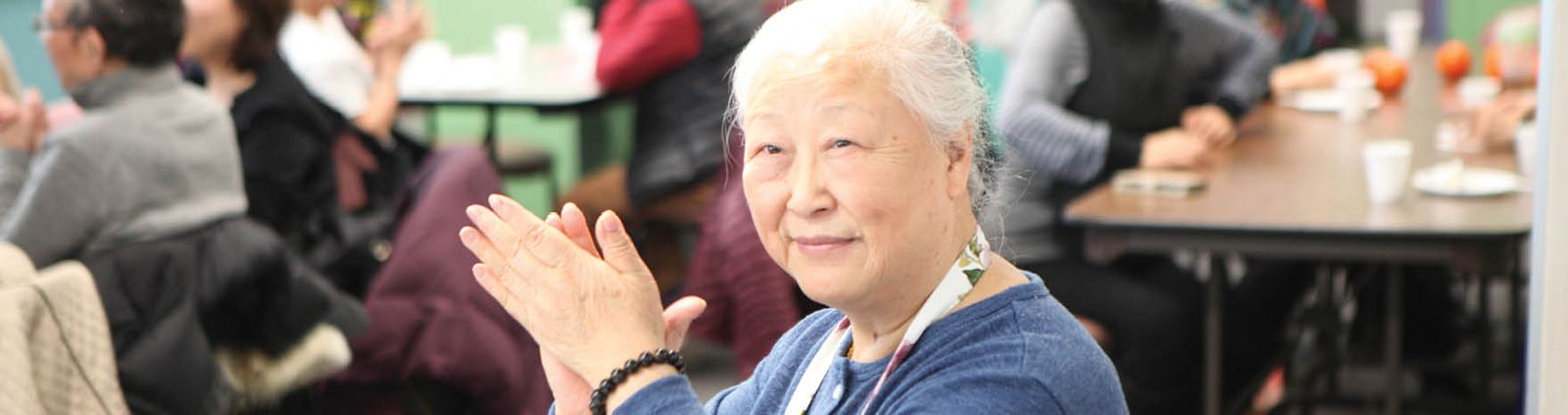 senior woman clapping