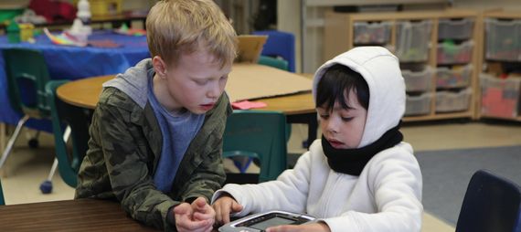 two young children at a desk