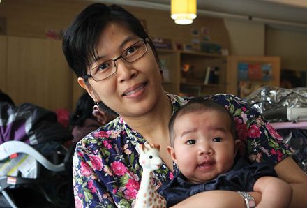 woman holding her baby