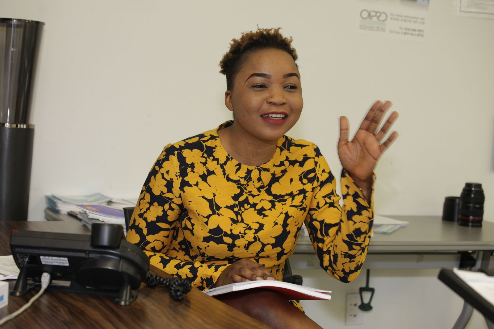 smiling youth sitting at a desk