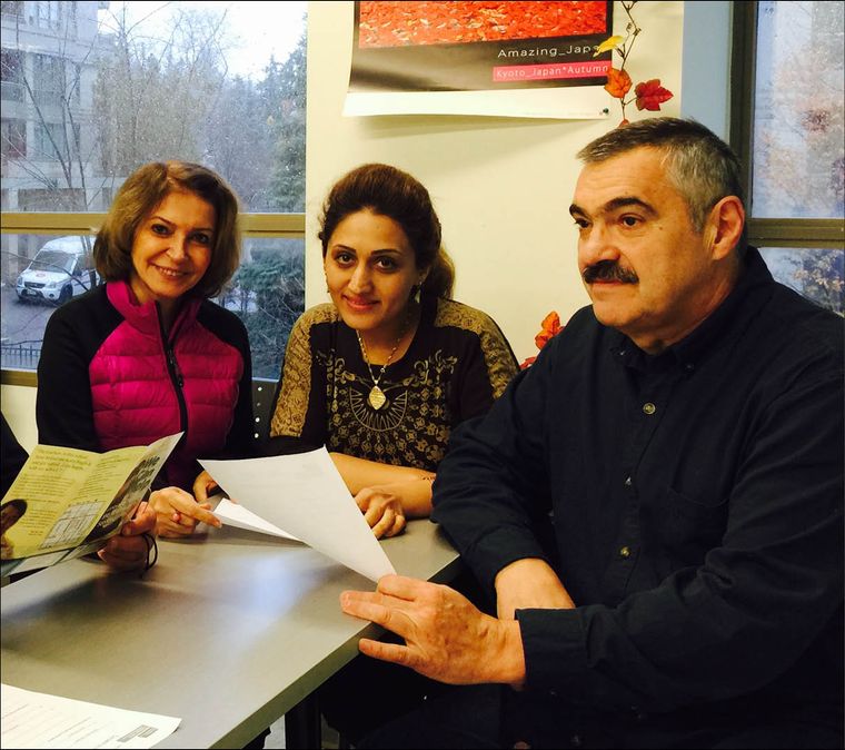 newcomers sitting at a table in our Newcomer Centre