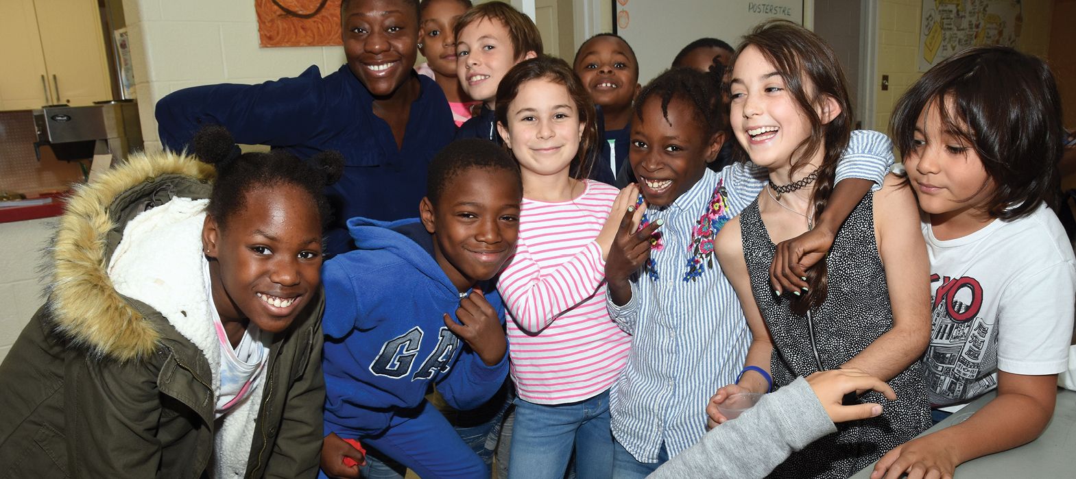 group of pre-teen boys and girls smiling