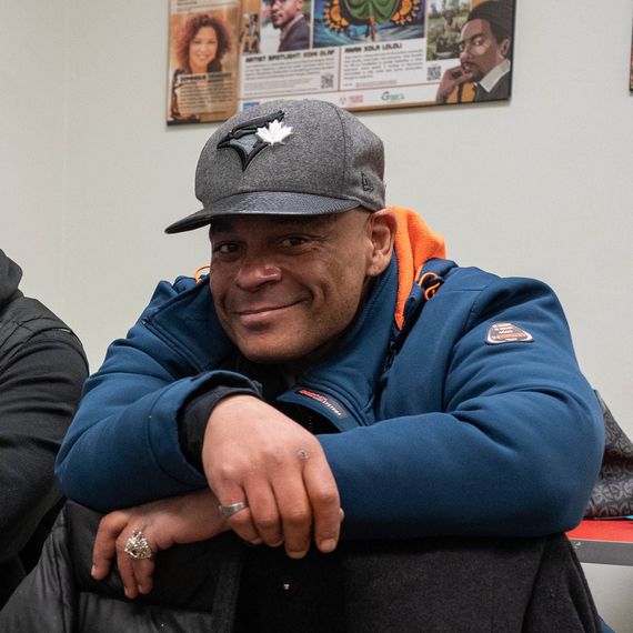 smiling man sitting at a table in a waiting room