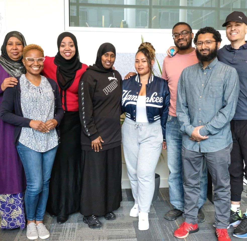 group of people posing and smiling