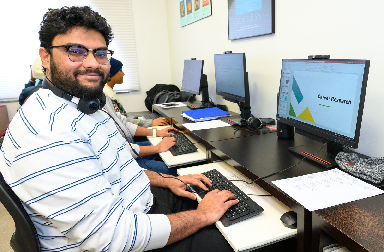 man sitting at a computer