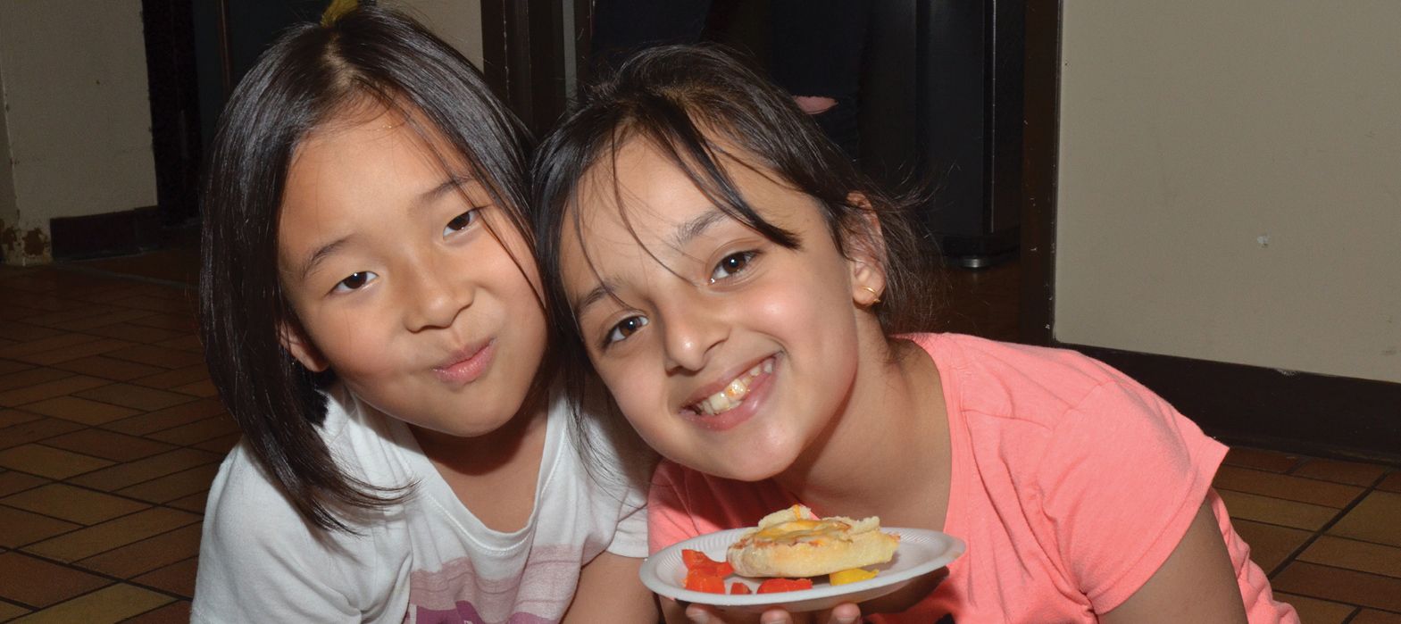 two young girls smiling