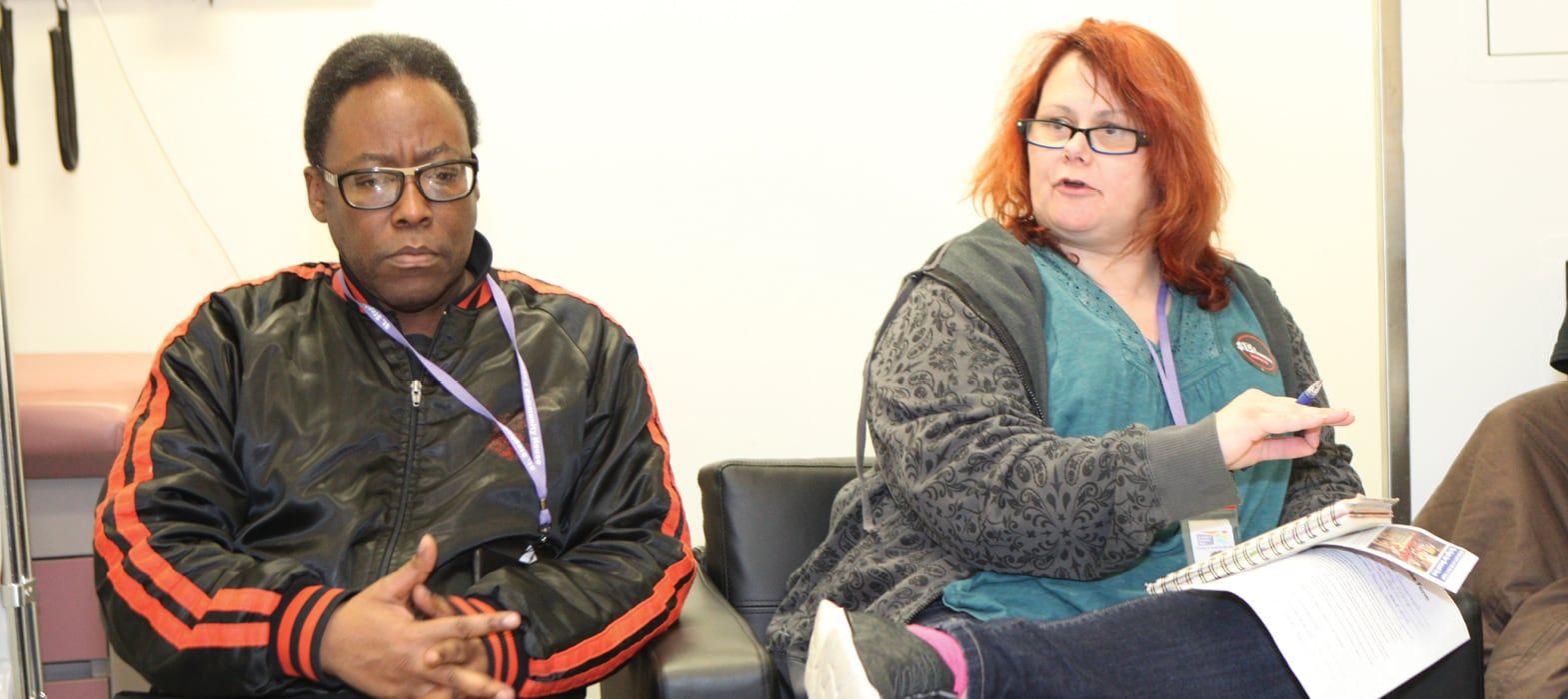 man and woman sitting and talking